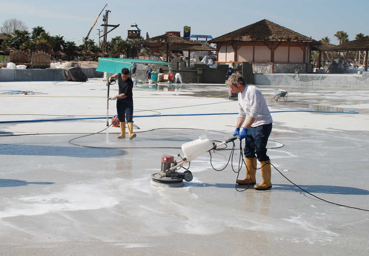 Ecobeton Degreaser used to clean the floor of a large swimming pool