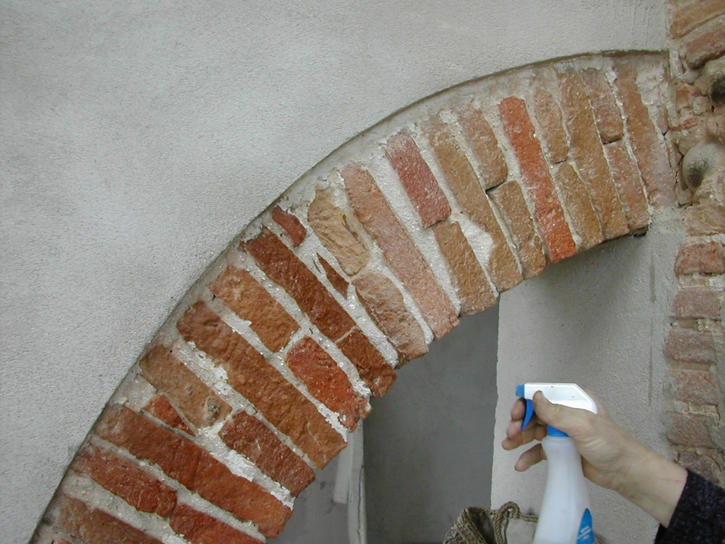 Spray application of Brickcover on a brick arch