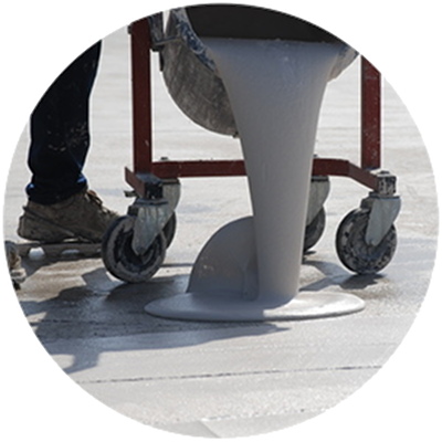 Pouring of the Ercole overlay on top of a concrete outdoor floor
