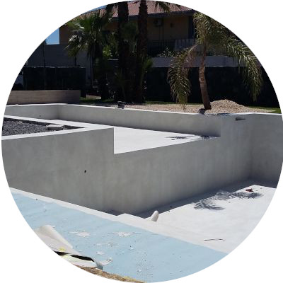 Empty swimming pool being coated with Poseidone