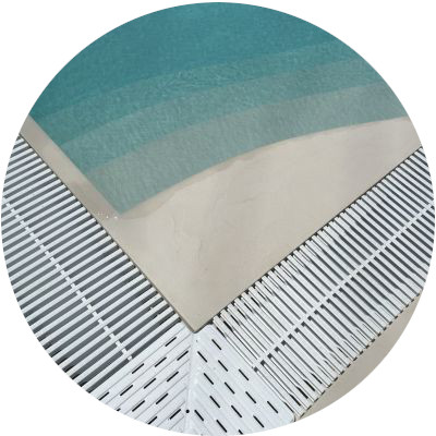 Close-up view of a corner with the entrance stairs of the pool covered with Poseidone